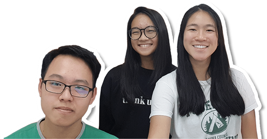 Three students smiling and posing together